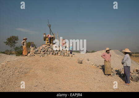 Female road construction crew building a road south of Nyaungshwe,Inle Lake,Burma,Myanmar,South East Asia, Asia, Stock Photo