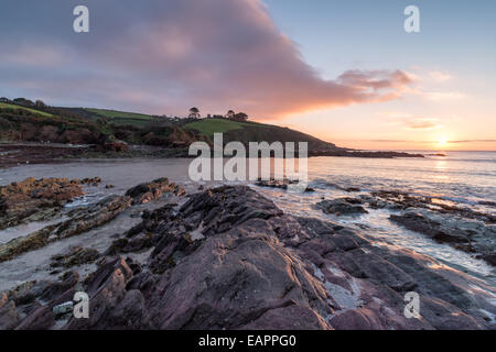 Sunrise at Talland Bay a secluded beach between Polperro and Looe in Cornwall Stock Photo