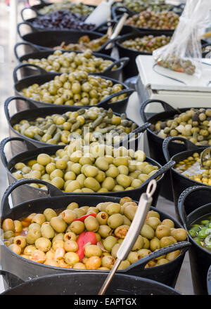 Buckets of Olives at a street vendor's stall. Large buckets of fresh olives entice buyers at this specialty vendor Stock Photo