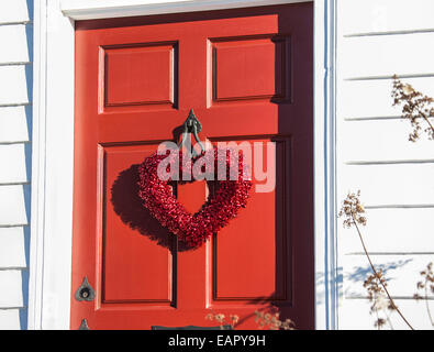 Red colour winter front door wreath, red heart wreath for Saint Valentines Day, Mercer County, New Jersey, USA, America, house red hearts Stock Photo