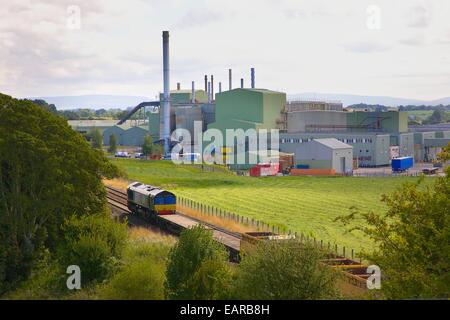 Direct Rail Services train passing British Gypsum plant. Kirkby Thore Eden Valley, Cumbria, Settle to Carlisle Railway Line, UK. Stock Photo