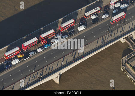 A close up aerial view of traffic crossing London Bridge into the City of London during morning rush hour Stock Photo