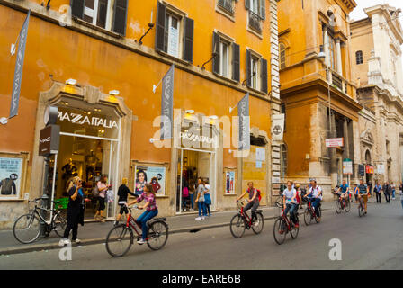 Guided bicycle tour group, Via del Corso, centro storico, central Rome, Italy Stock Photo