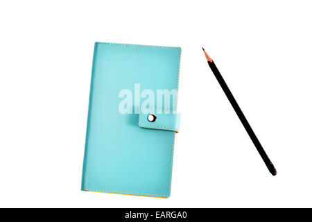 Blue leather organizer or diary with black pencil isolated on white background Stock Photo