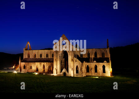 A view of Tintern Abbey illuminated at night. Stock Photo