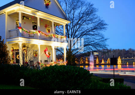 This traditional, Victorian-style home in a Christmas town/village is beautifully decorated for the Holiday Season. Stock Photo