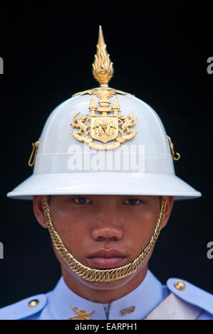 A soldier of the Kings Guard with a white helmet and gold chin-strap. Stock Photo