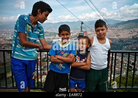 Children in front of the Espana Library, and The Medellin Metrocable. Stock Photo