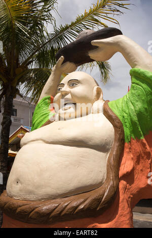 Mauritius, Grand Baie, bazaar, Happy Laughing Buddha With Arms Raised holding begging bowl feng shui figure Stock Photo