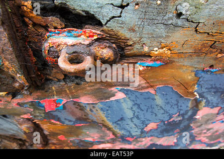 Peeling paint on an old boat run aground at Salen on the Isle of Mull, Scotland, UK. Stock Photo