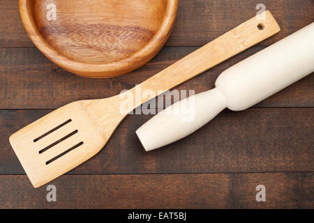 wooden kitchen utensil: plate, rolling pin, spoon for stirring, top view Stock Photo