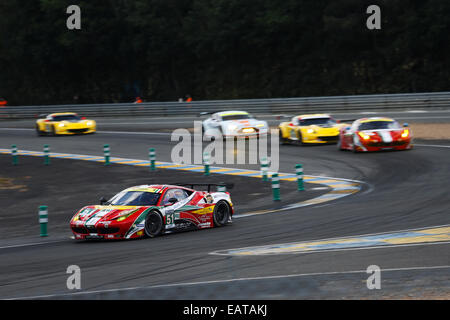 Ferrari 458 Italia pulling away from competition at Le Mans 24H race in Mulsanne corner Stock Photo