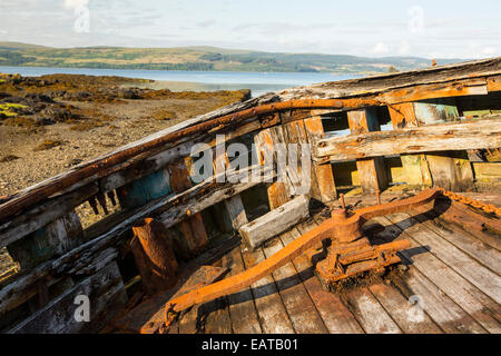 An old fishing boat run aground at Salen on the Isle of Mull, Scotland, UK. Stock Photo