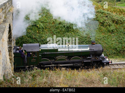 GWR loco No 5029 Nunney Castle climbing the steep gradient towards Goathland on the North Yorkshire Moors Railway. Stock Photo