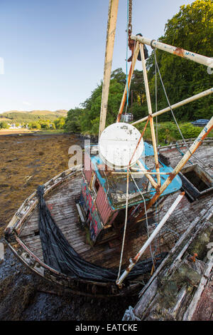 An old fishing boat run aground at Salen on the Isle of Mull, Scotland, UK. Stock Photo