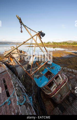 An old fishing boat run aground at Salen on the Isle of Mull, Scotland, UK. Stock Photo