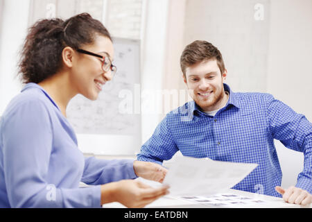 smiling team with paper at office Stock Photo