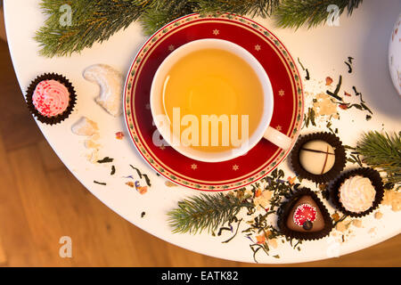 Cup of tea served with chocolate for Christmas Stock Photo