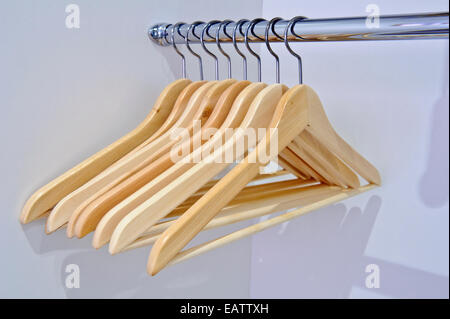 New coat hangers in an inner city townhouse apartment wardrobe. Stock Photo