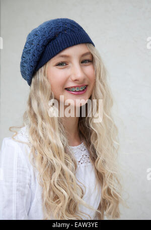 Photo of beautiful young blond girl with braces Stock Photo