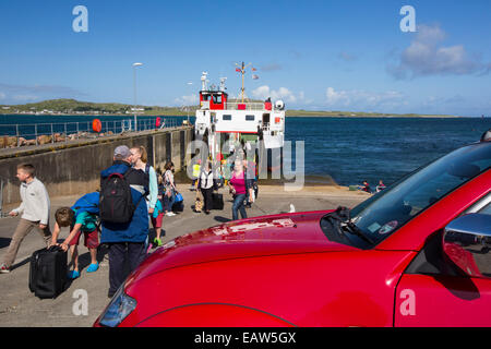 Passengers disembarking the Iona ferry at Fionnphort Isle of Mull, Scotland, UK, looking towards Iona. Stock Photo