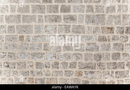 Gray brick background, grunge style brickwork wall, stylish modern architecture detail, building exterior, stonewall texture Stock Photo