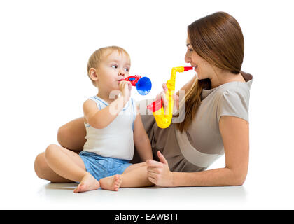 kid and mother play musical toys Stock Photo