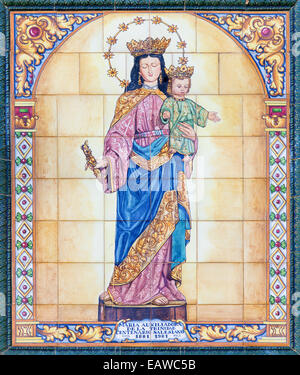 SEVILLE, SPAIN - OCTOBER 29, 2014: The ceramic tiled Madonna in the church Basilica del Maria Auxiliadora Stock Photo