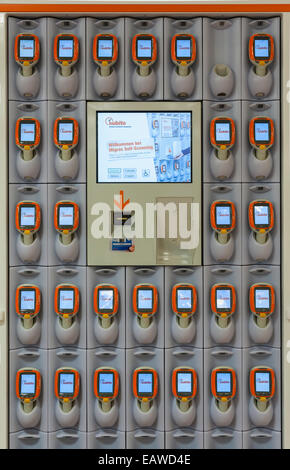 Rack with handheld Subito self-scanning devices in a Migros supermarket in Zurich, Switzerland. Stock Photo