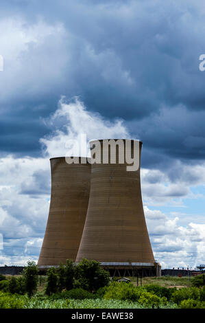 Steam rises from the cooling towers of an electricity power station. Stock Photo