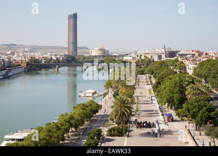 Seville - The outlook from Torre del Oro to promenade on the waterfront of Guadalquivir river and modern Torre Cajasol. Stock Photo