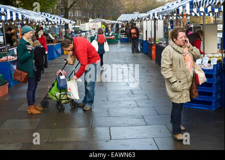 Customers browsing stalls at Edinburgh Farmers Market in city centre Edinburgh Scotland UK Stock Photo