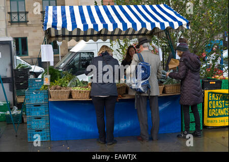 Customers browsing stalls at Edinburgh Farmers Market in city centre Edinburgh Scotland UK Stock Photo