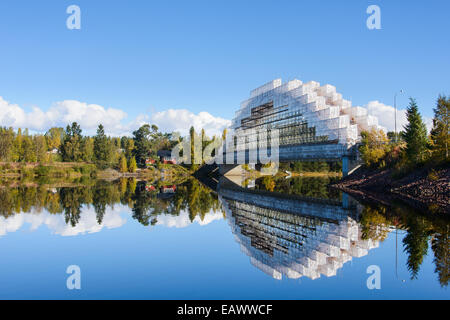 Unique bridge under construction over a still lake Stock Photo