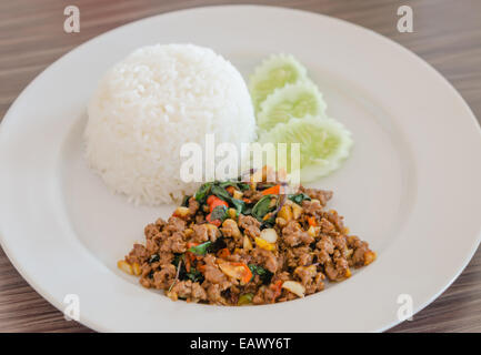 steamed  Rice topped with stir fried minced pork ,chili and  basil Stock Photo