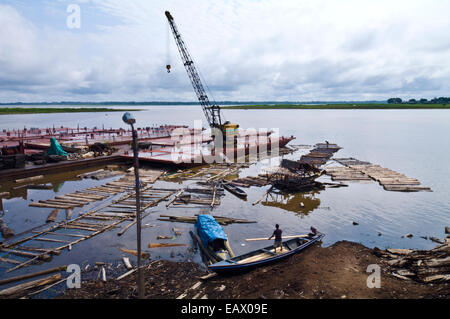 Empty logging mill barges moored on the shore of the Amazon river waiting to collect more trees. Stock Photo