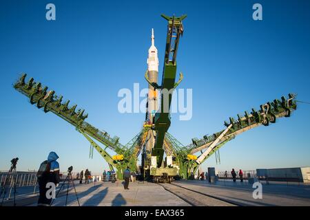 The Soyuz TMA-15M spacecraft is rolled into position on the launch pad at the Baikonur Cosmodrome November 21, 2014 in Kazakhstan. Launch of the Soyuz rocket is scheduled for November 24 and will carry Expedition 42 crew for a five and a half month mission on the International Space Station. Stock Photo