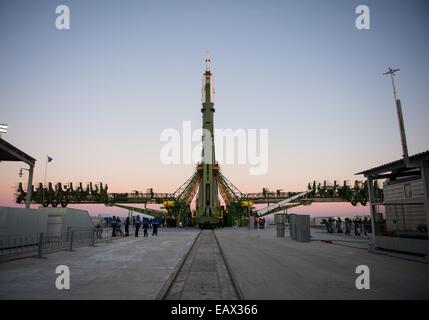 The Soyuz TMA-15M spacecraft is rolled into position on the launch pad at the Baikonur Cosmodrome November 21, 2014 in Kazakhstan. Launch of the Soyuz rocket is scheduled for November 24 and will carry Expedition 42 crew for a five and a half month mission on the International Space Station. Stock Photo
