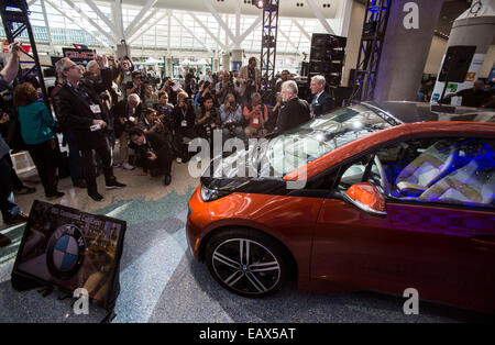 Los Angeles, USA. 21st Nov, 2014. Journalists take photos of a BMW i3 at the 2014 Los Angeles Auto Show in Los Angeles, the United States, on Nov. 20. 2014. BMW i3 won Green Car of the year award at the 2014 Los Angeles Auto Show on Thursday. © Zhao Hanrong/Xinhua/Alamy Live News Stock Photo