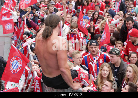 Bayern Muenchen presenting the trophy to the fans at Marienplatz after winning the DFB Cup Final match.  Featuring: Fans Where: Munich, Germany When: 18 May 2014 Stock Photo