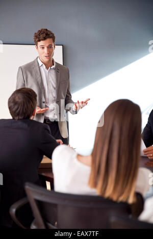 Businessman presenting at business meeting Stock Photo