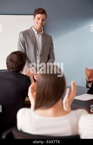 Businessman directing meeting discussion Stock Photo