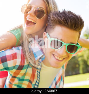 smiling couple having fun in park Stock Photo