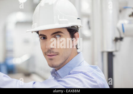 Engineer at work in industrial plant, portrait Stock Photo