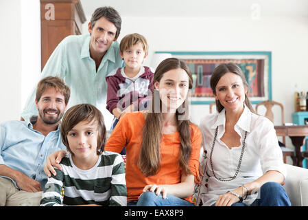 Family together in living room, portrait Stock Photo