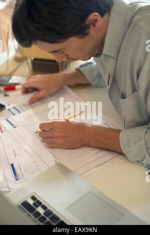 Architect working on blueprint Stock Photo