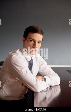 Businessman sitting in office, portrait Stock Photo
