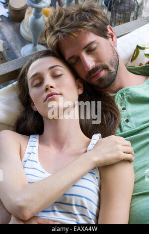 Young couple reclining together Stock Photo