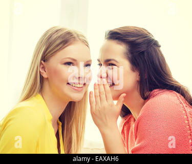 one girl telling another secret Stock Photo