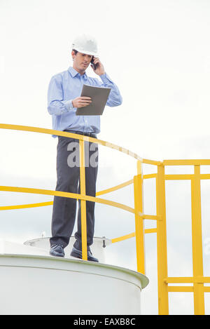 Engineer conducting safety inspection at industrial plant Stock Photo
